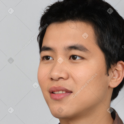 Joyful asian young-adult male with short  black hair and brown eyes