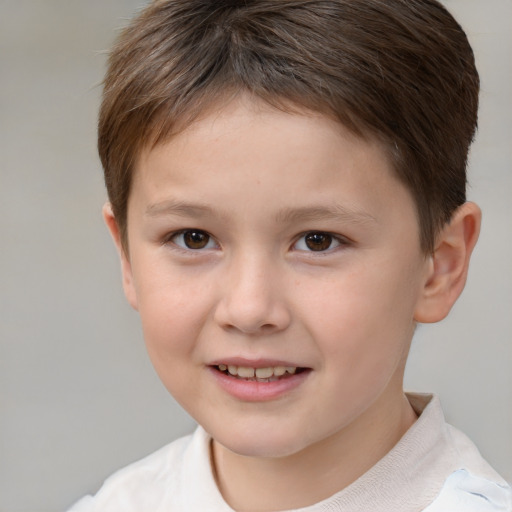 Joyful white child male with short  brown hair and brown eyes