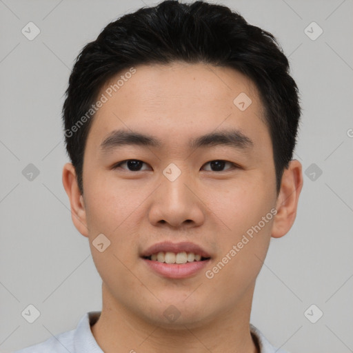 Joyful asian young-adult male with short  black hair and brown eyes