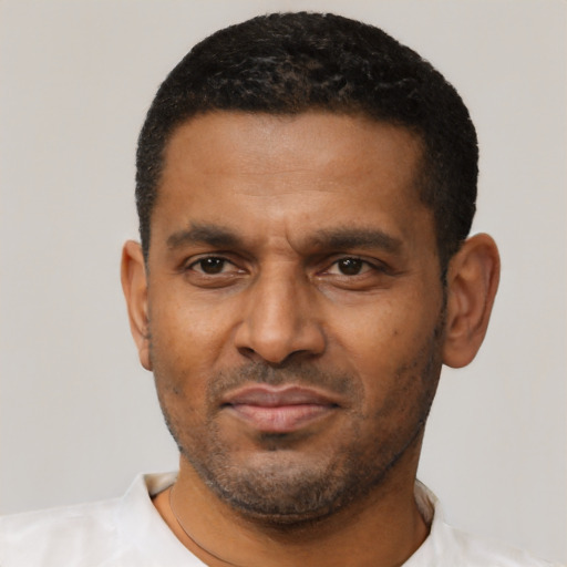 Neutral latino adult male with short  black hair and brown eyes