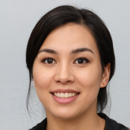 Joyful asian young-adult female with medium  black hair and brown eyes