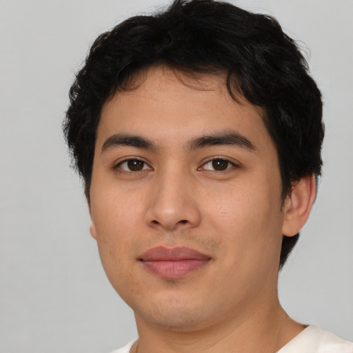 Joyful asian young-adult male with short  brown hair and brown eyes