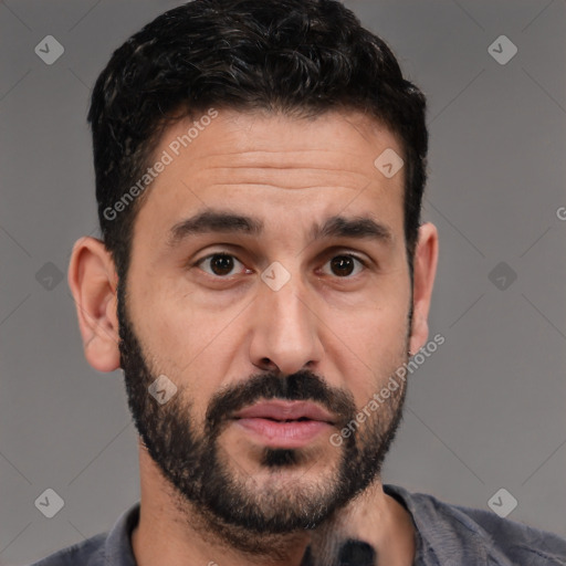 Joyful white young-adult male with short  black hair and brown eyes