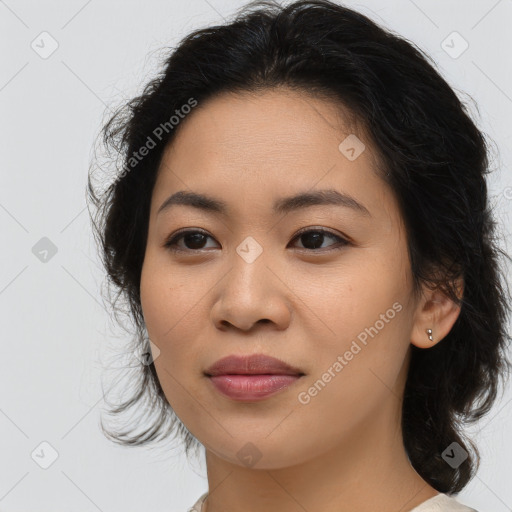 Joyful asian young-adult female with long  brown hair and brown eyes