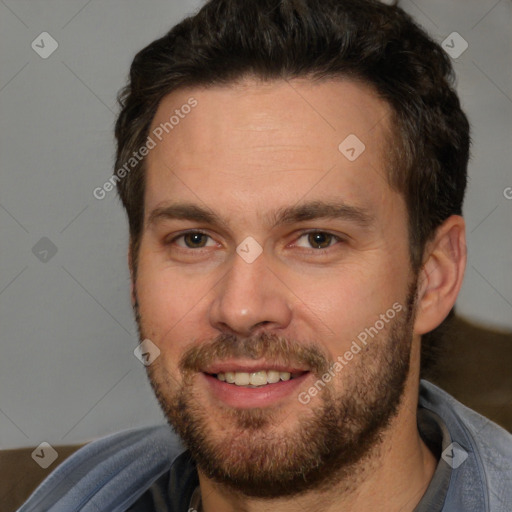 Joyful white adult male with short  brown hair and brown eyes