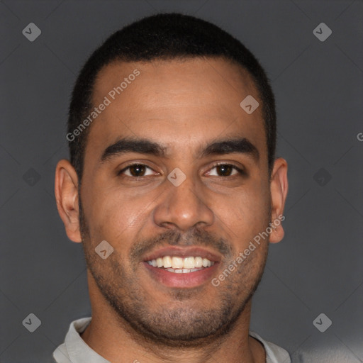 Joyful black young-adult male with short  brown hair and brown eyes