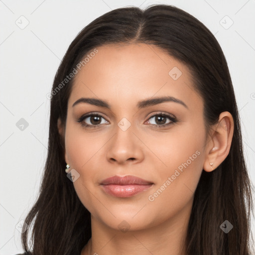 Joyful latino young-adult female with long  brown hair and brown eyes