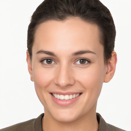 Joyful white young-adult female with short  brown hair and brown eyes