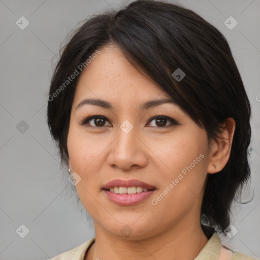 Joyful asian young-adult female with medium  brown hair and brown eyes