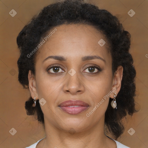 Joyful black adult female with medium  brown hair and brown eyes