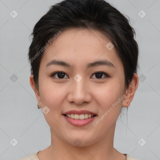 Joyful asian young-adult female with short  brown hair and brown eyes