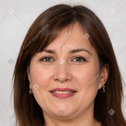 Joyful white adult female with long  brown hair and grey eyes