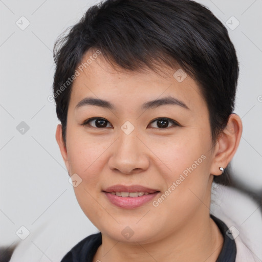 Joyful asian young-adult female with short  brown hair and brown eyes