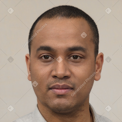 Neutral latino young-adult male with short  black hair and brown eyes