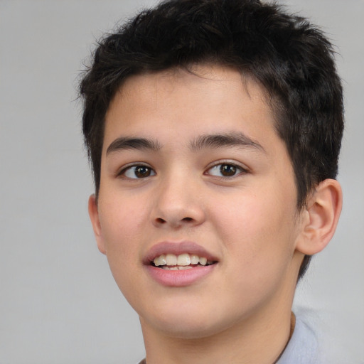 Joyful white child male with short  brown hair and brown eyes