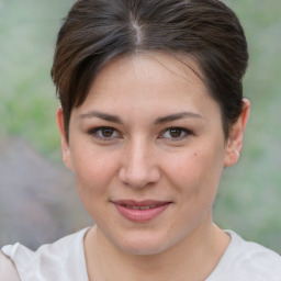 Joyful white young-adult female with short  brown hair and brown eyes