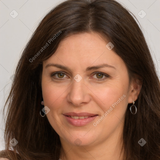 Joyful white adult female with long  brown hair and brown eyes