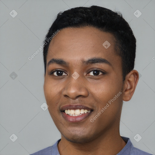 Joyful black young-adult male with short  black hair and brown eyes