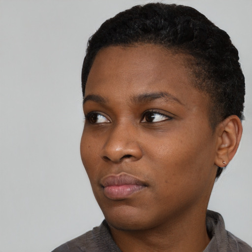 Neutral black young-adult female with short  black hair and brown eyes