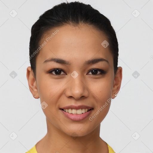 Joyful latino young-adult female with short  brown hair and brown eyes