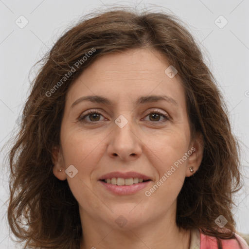 Joyful white adult female with long  brown hair and brown eyes