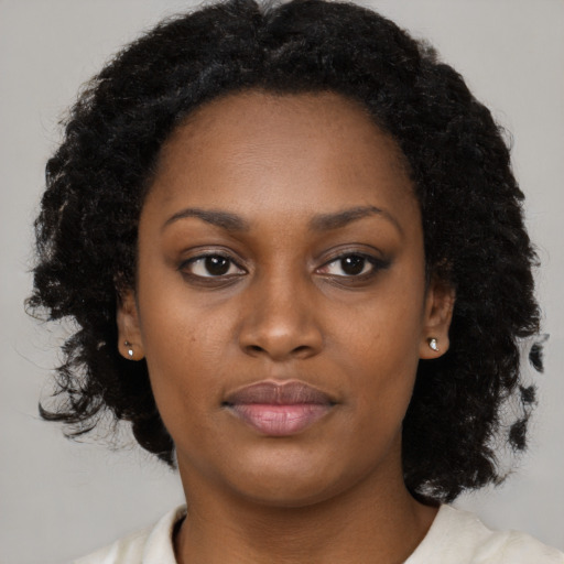 Neutral black young-adult female with medium  black hair and brown eyes