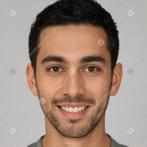 Joyful white young-adult male with short  black hair and brown eyes