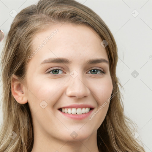 Joyful white young-adult female with long  brown hair and green eyes