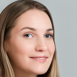 Joyful white young-adult female with long  brown hair and blue eyes