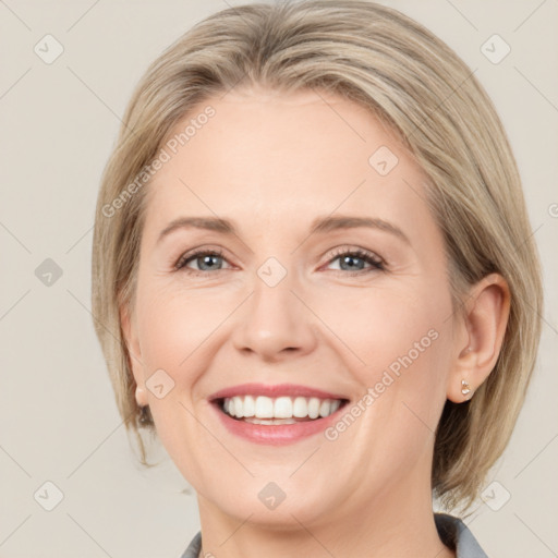 Joyful white adult female with medium  brown hair and grey eyes