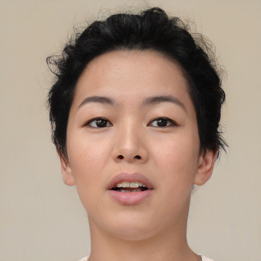 Joyful asian young-adult female with short  brown hair and brown eyes