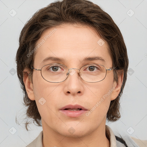 Joyful white adult female with medium  brown hair and grey eyes