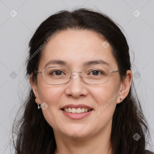 Joyful white adult female with long  brown hair and brown eyes