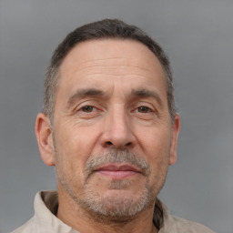 Joyful white middle-aged male with short  brown hair and brown eyes