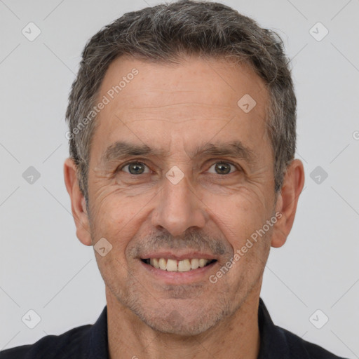 Joyful white adult male with short  brown hair and brown eyes