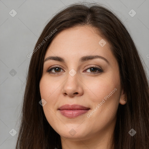 Joyful white young-adult female with long  brown hair and brown eyes