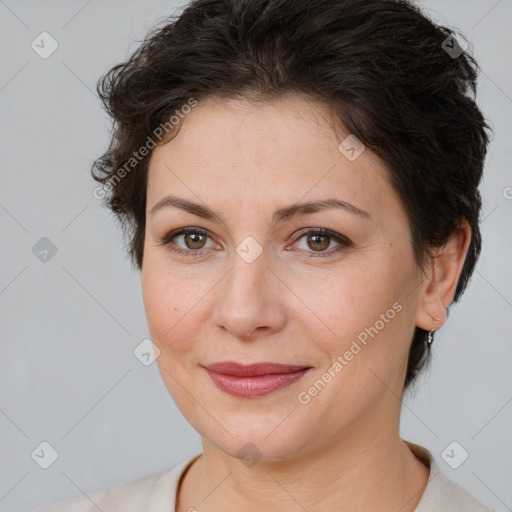 Joyful white adult female with short  brown hair and brown eyes