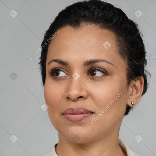 Joyful latino young-adult female with short  brown hair and brown eyes