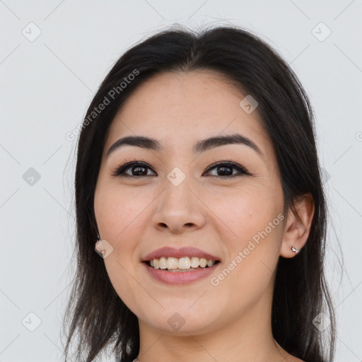 Joyful asian young-adult female with long  brown hair and brown eyes