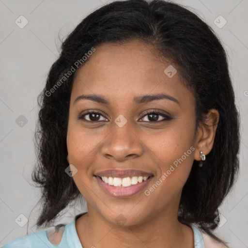 Joyful black young-adult female with long  brown hair and brown eyes