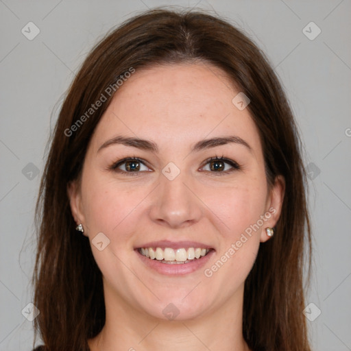 Joyful white young-adult female with long  brown hair and brown eyes