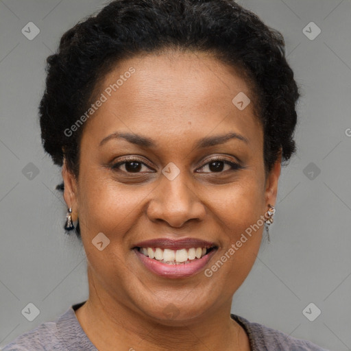 Joyful black adult female with short  brown hair and brown eyes