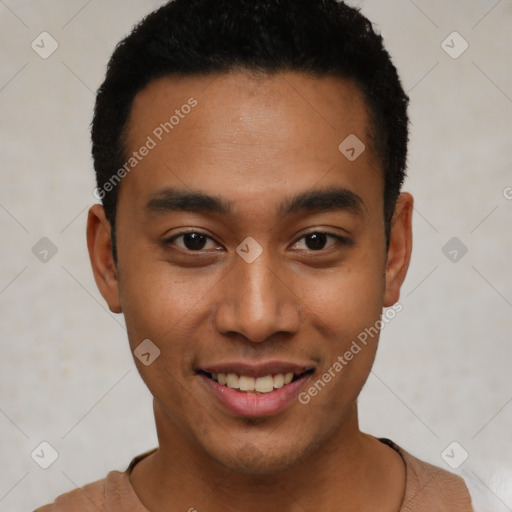 Joyful latino young-adult male with short  brown hair and brown eyes