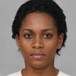 Neutral black young-adult female with short  black hair and brown eyes