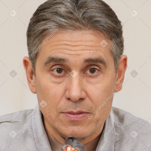 Joyful white middle-aged male with short  brown hair and brown eyes