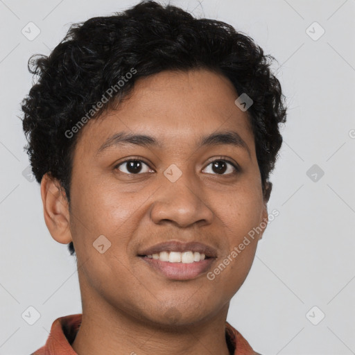 Joyful latino young-adult male with short  brown hair and brown eyes