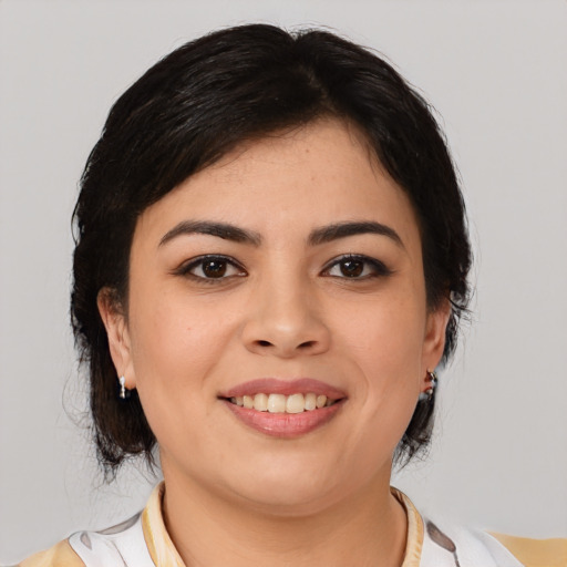 Joyful latino young-adult female with medium  black hair and brown eyes