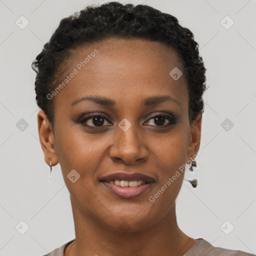 Joyful black young-adult female with short  brown hair and brown eyes