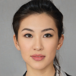 Neutral asian young-adult female with medium  brown hair and brown eyes