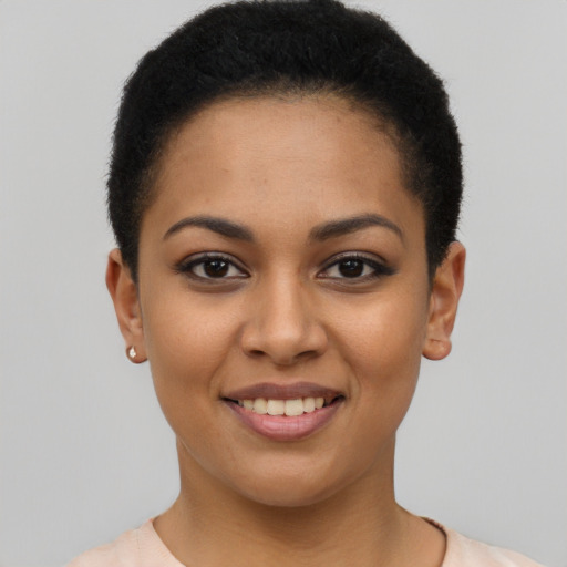 Joyful latino young-adult female with short  brown hair and brown eyes
